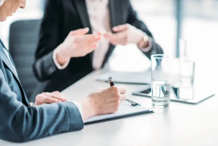 People at table with hands